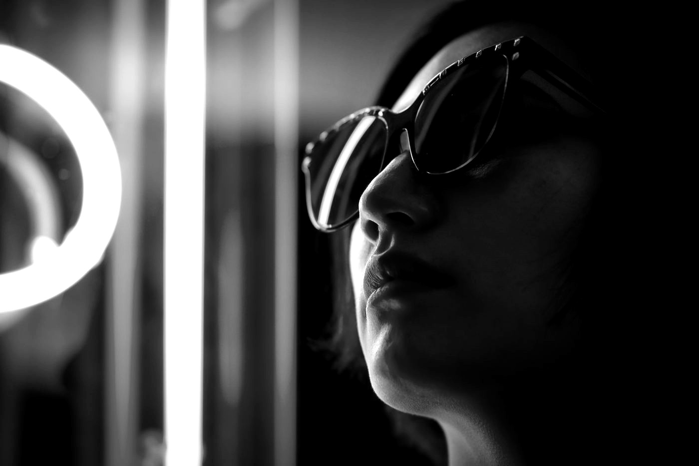 Black-and-white neon fashion editorial portrait for Kisau Photography