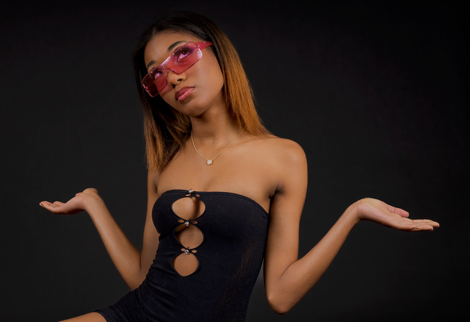 Color fashion editorial portrait of a model wearing pink sunglasses for Kisau Photography