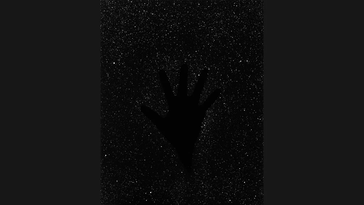 Davide Tranchina’s black-and-white Big Bang Self Portrait shows the silhouette of a hand against a dense field of white points.
