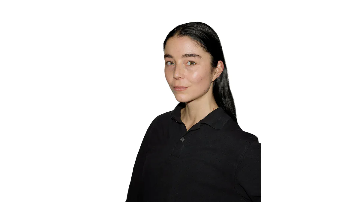 Official LVMH Prize portrait of designer Julie Kegels in a black collared shirt against a white background.