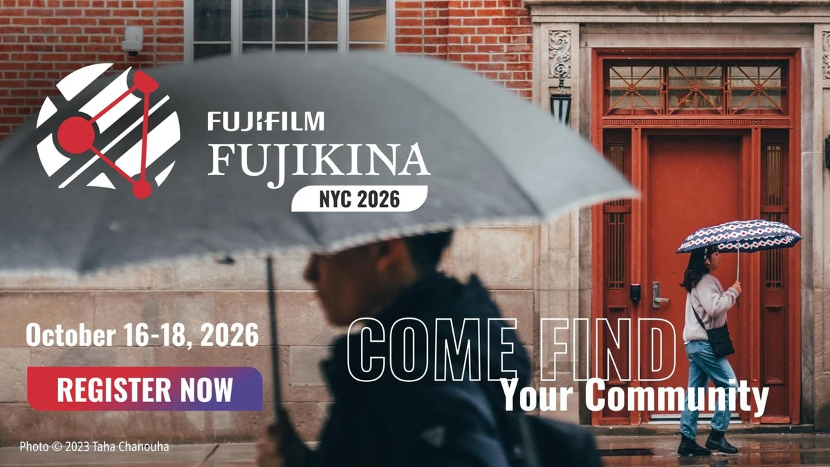 Official FUJIKINA NYC 2026 festival banner using Taha Chanouha’s 2023 street photograph of two people with umbrellas and announcing October 16–18, 2026