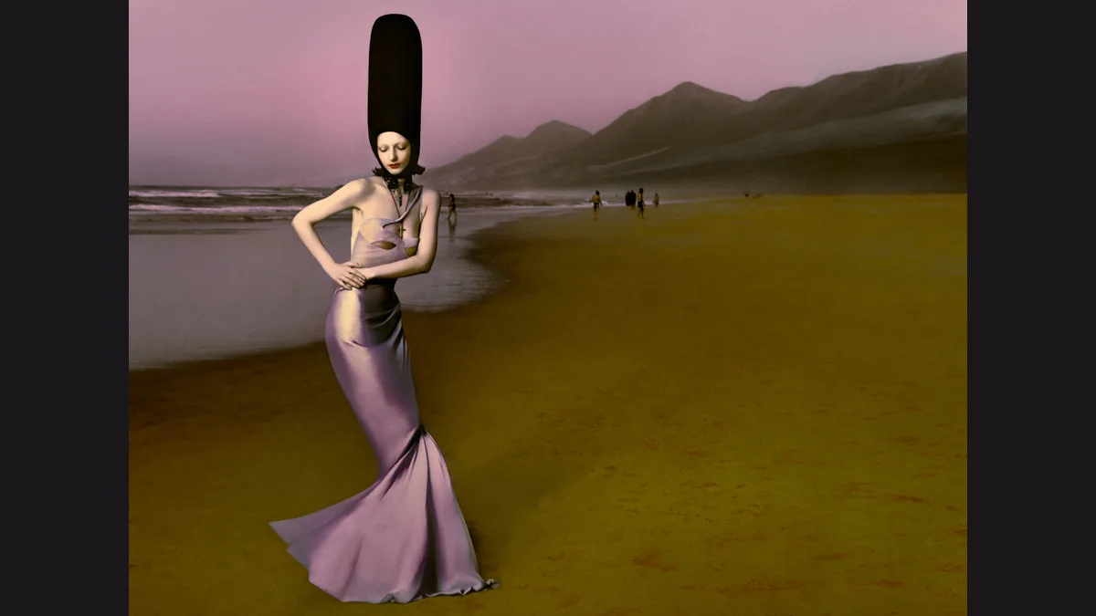 Cécile Paravina in a lavender gown and tall dark headpiece on a beach in Elizaveta Porodina’s The Return, with the full photograph preserved on a dark matte
